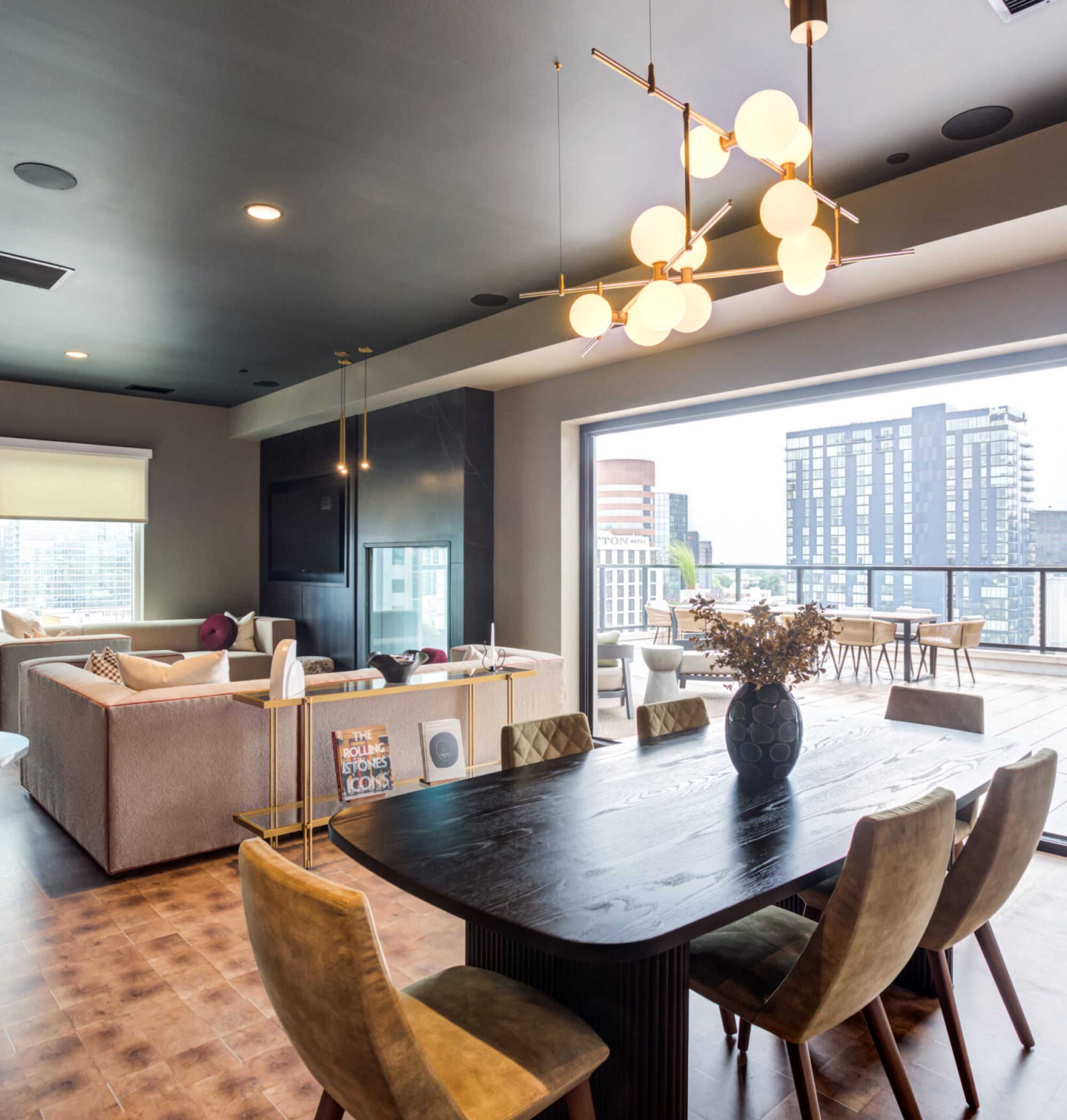 LOCAL Nashville apartments skydeck rendering with lounge chairs and downtown city views