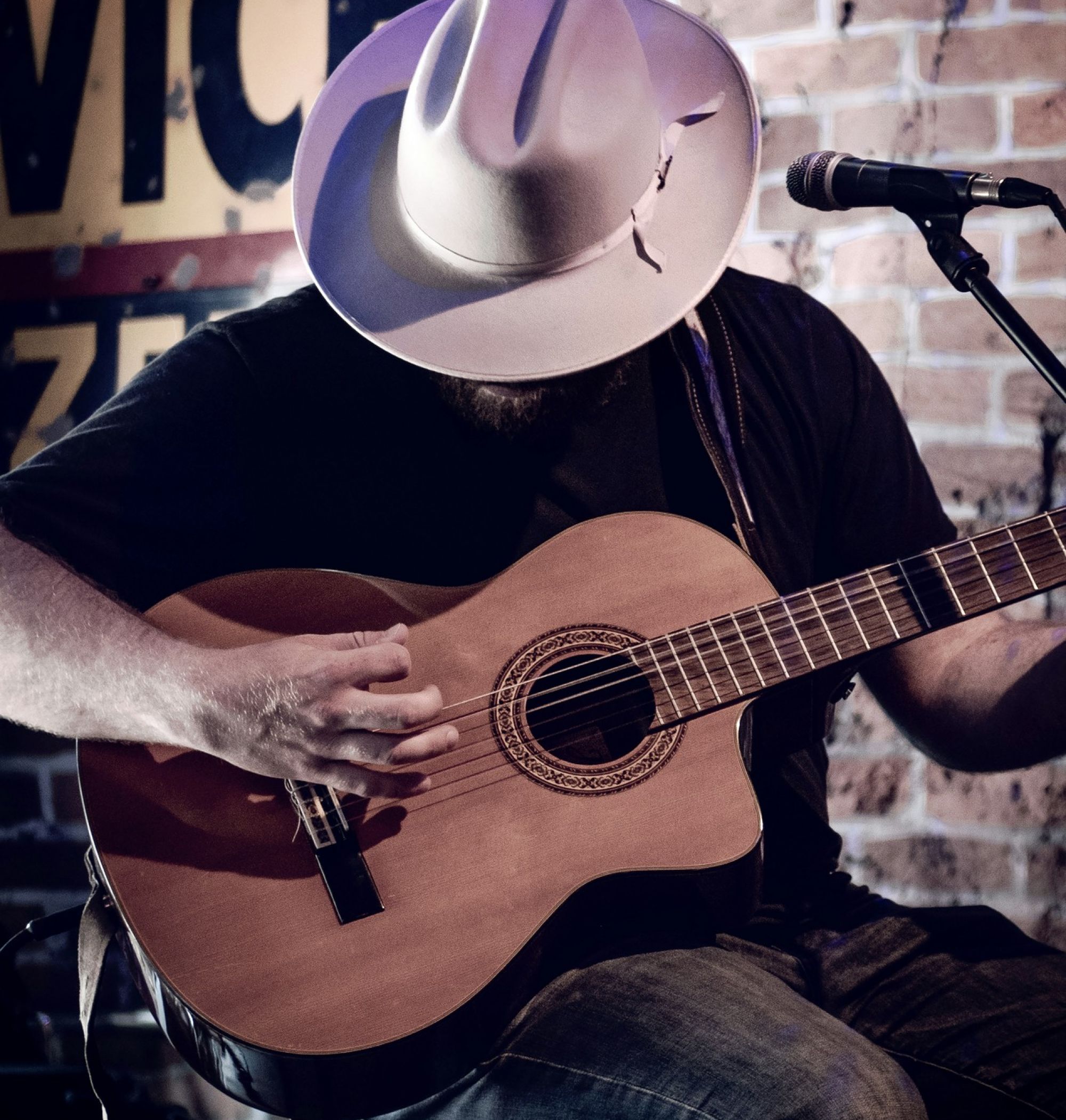 Guitarist in a cowboy hat performing live in Nashville, TN