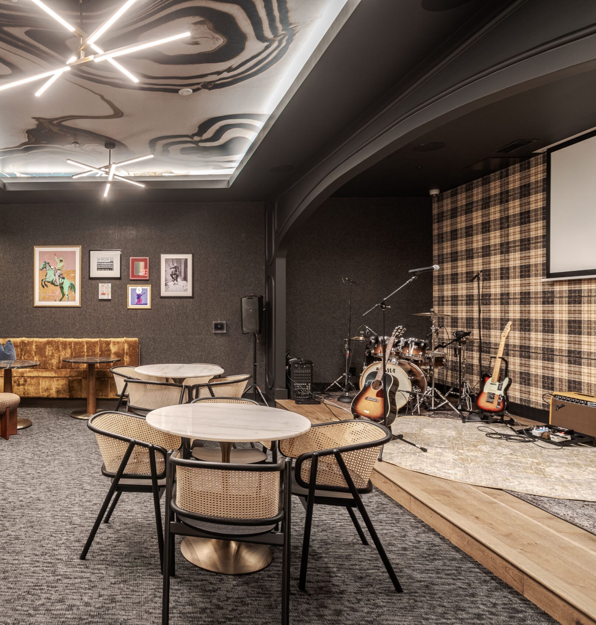 LOCAL Nashville Apartments music room with seating area and a stage
