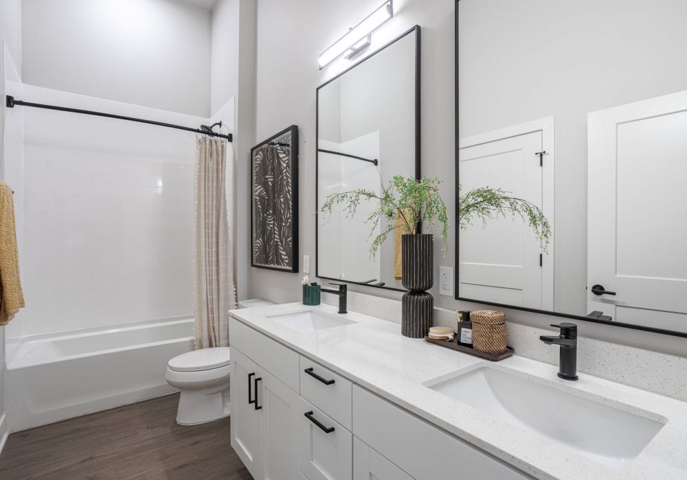 LOCAL Nashville apartments bathroom rendering with white vanity and modern furnishings