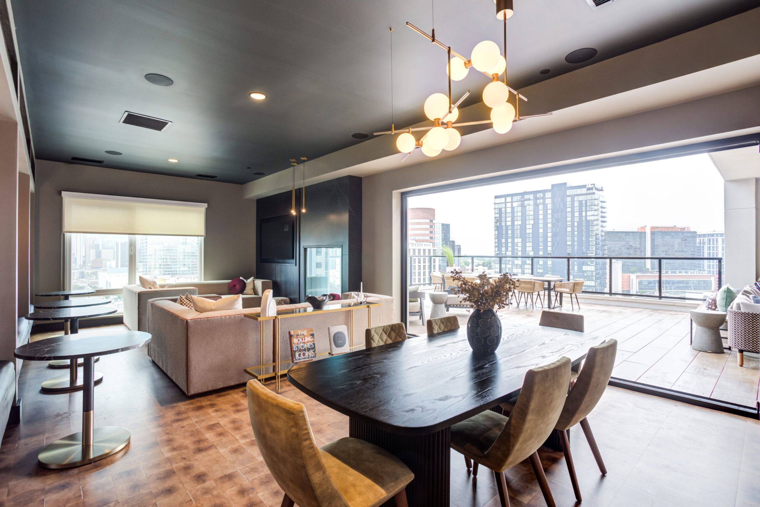 LOCAL Nashville apartments skydeck rendering with lounge chairs and downtown city views