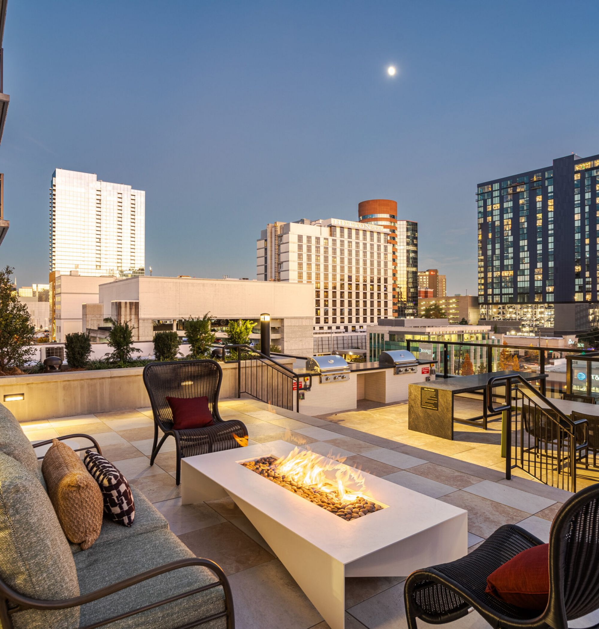 LOCAL Nashville apartments terrace rendering with seating areas on a rooftop terrace with views of the city