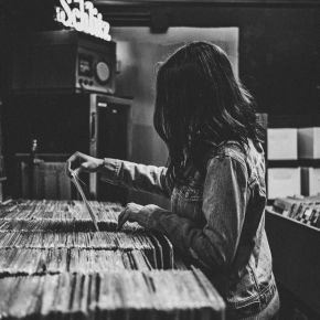 Woman shopping for records in a record shop
